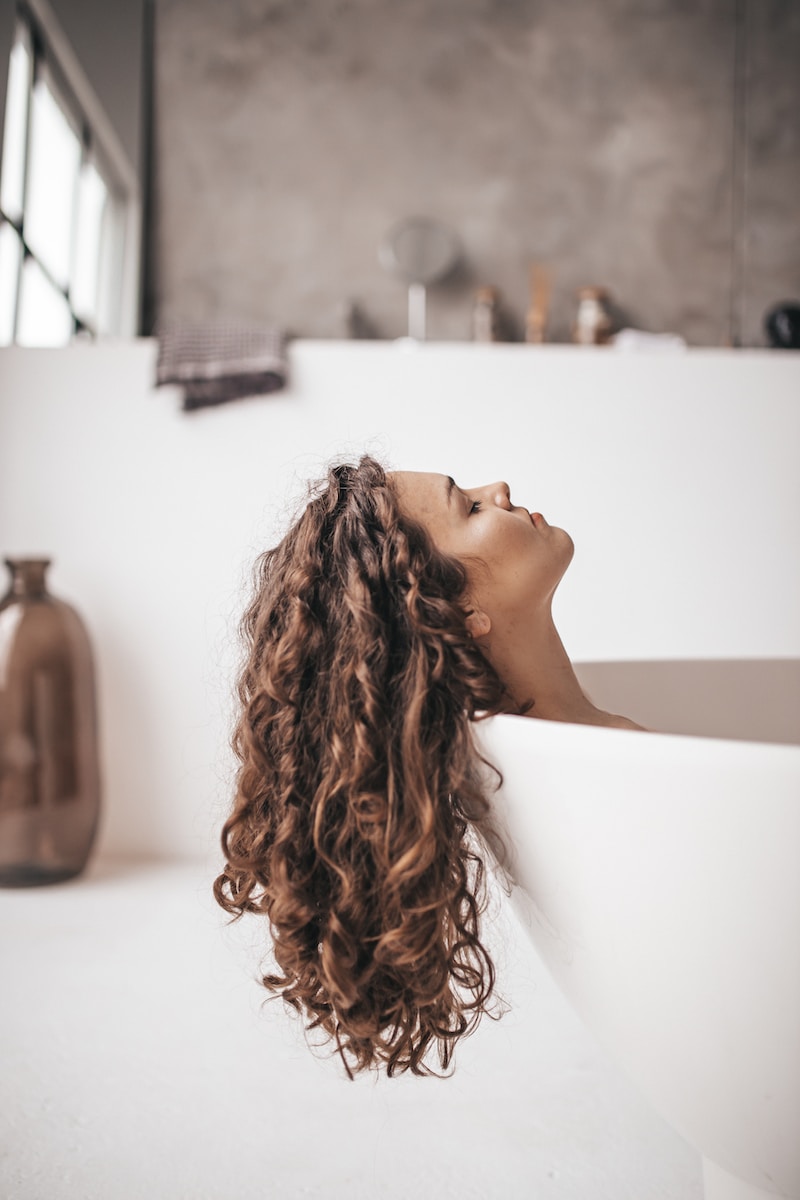 Photo by Taisiia Stupak woman in bathtub